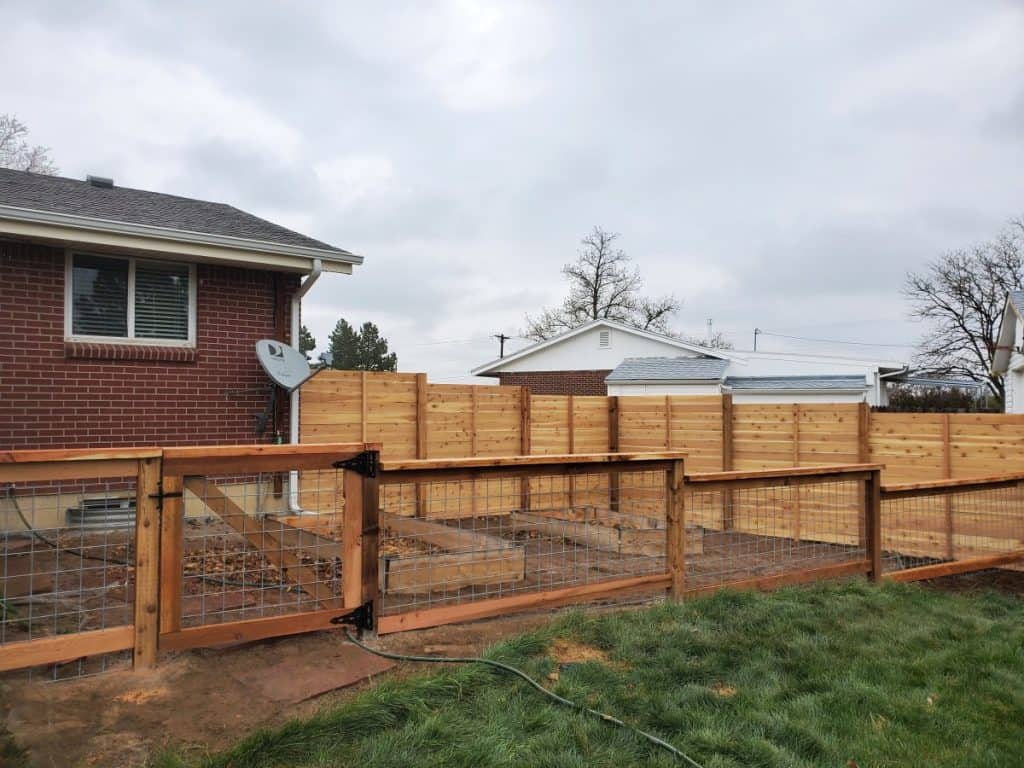 Chain link fence installed to keep animals out of the garden