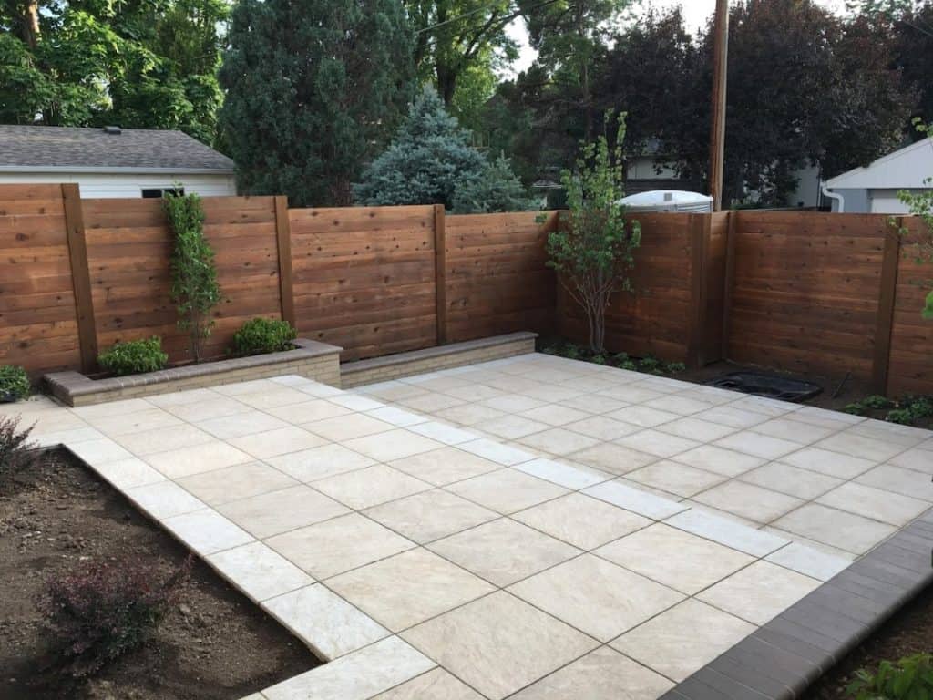 New wood fence with a new concrete patio