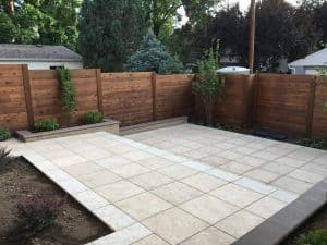 New wood fence with a new concrete patio