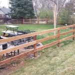 Wood field fence installed in a yard in Denver, Co